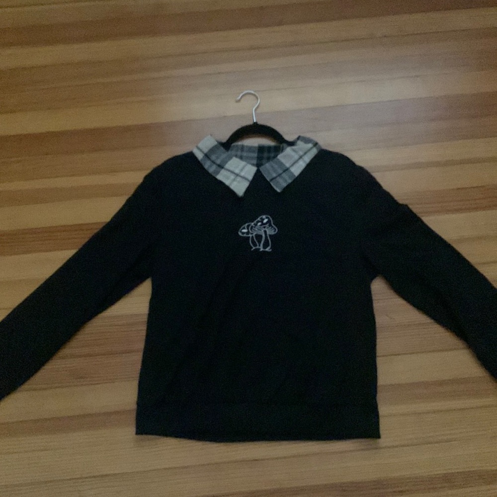 black sweatshirt with a mushroom and built in collars